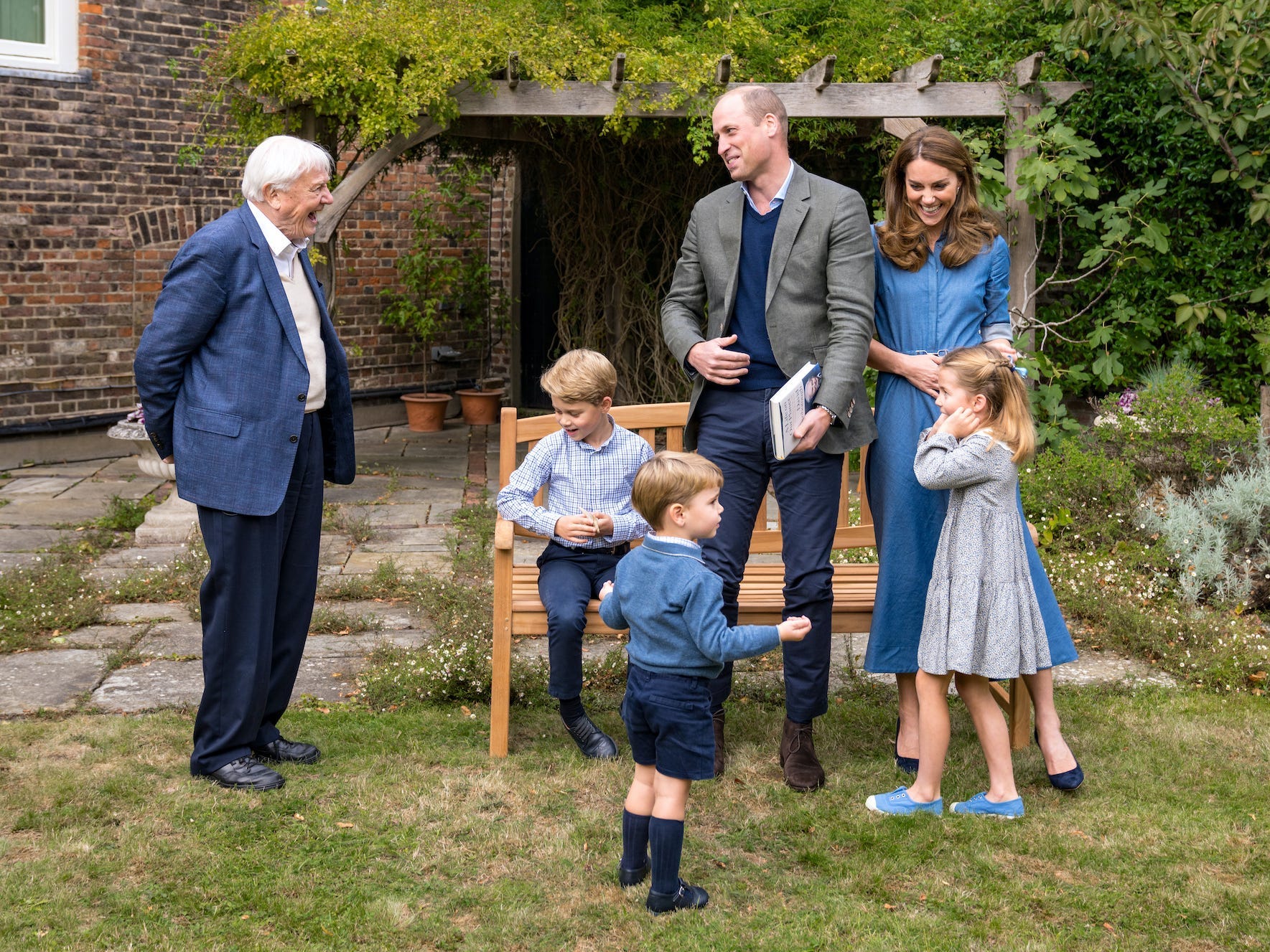 Prince William, Kate Middleton, and their kids met David Attenborough at the gardens outside Kensington Palace..JPG