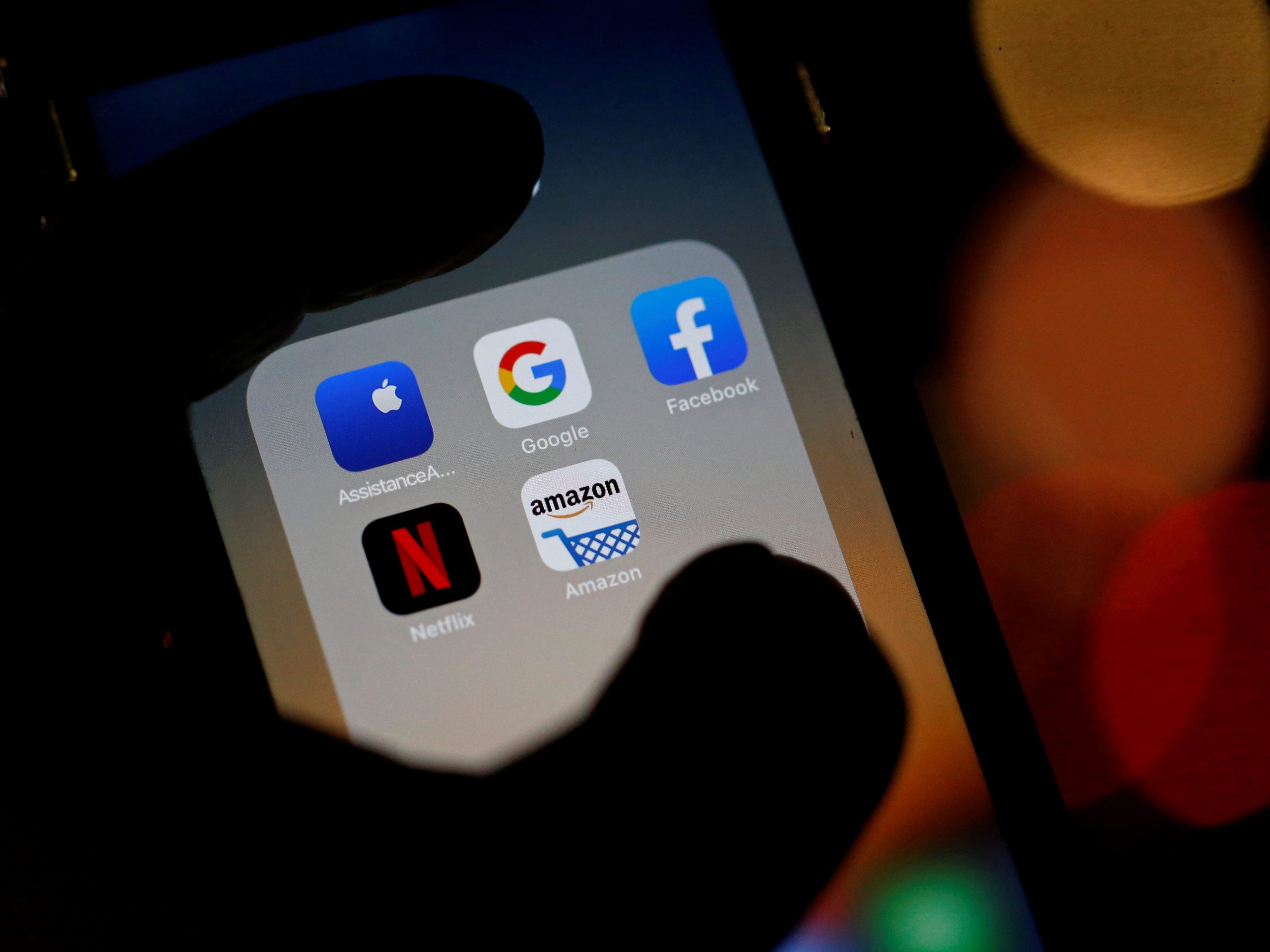 FILE PHOTO: The logos of mobile apps, Google, Amazon, Facebook, Apple and Netflix, are displayed on a screen in this illustration picture taken December 3, 2019. REUTERS/Regis Duvignau