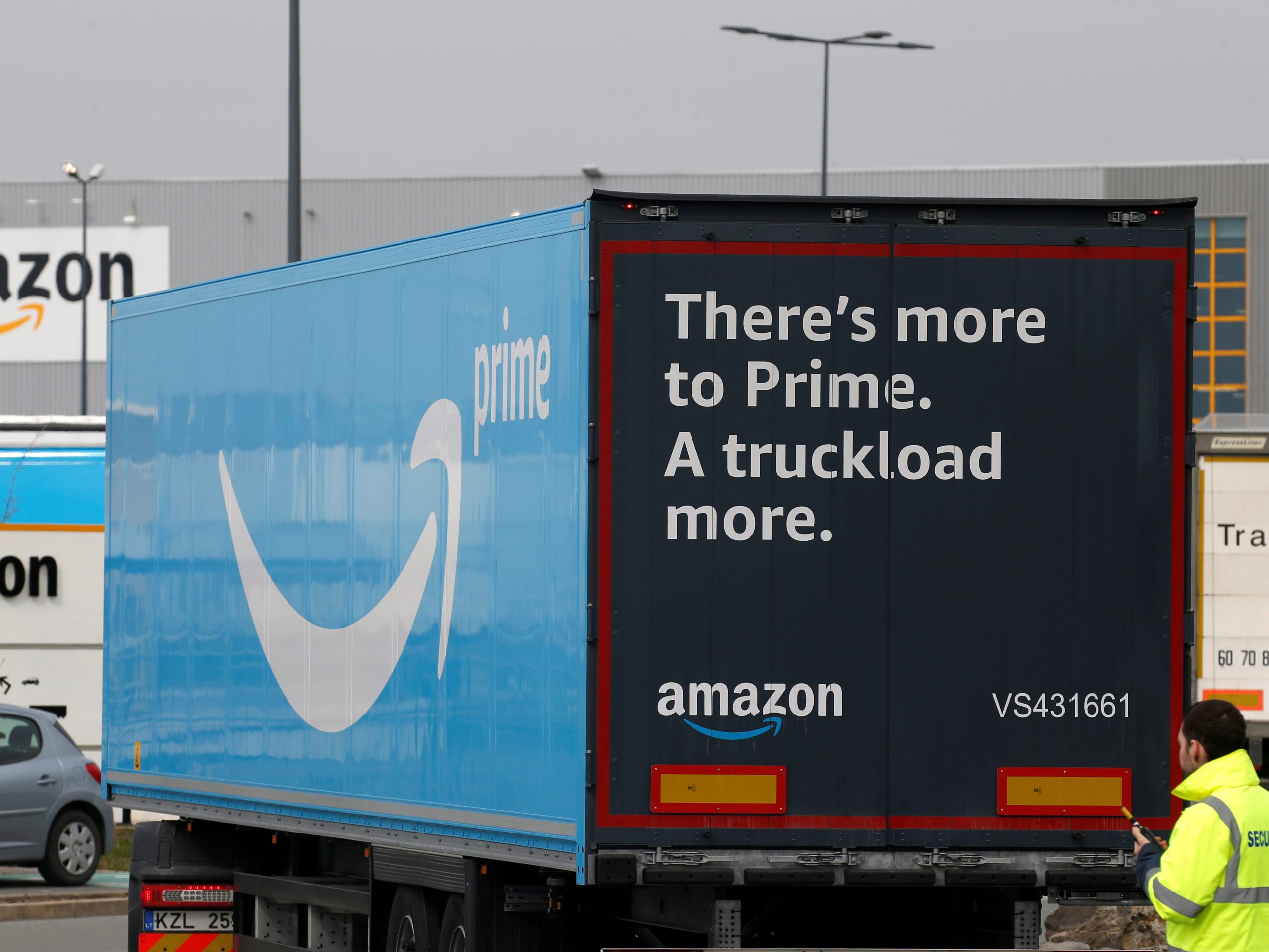 FILE PHOTO: A truck with the logo of Amazon Prime Delivery arrives at the Amazon logistics center in Lauwin-Planque, northern France, March 19, 2020.. REUTERS/Pascal Rossignol/File Photo