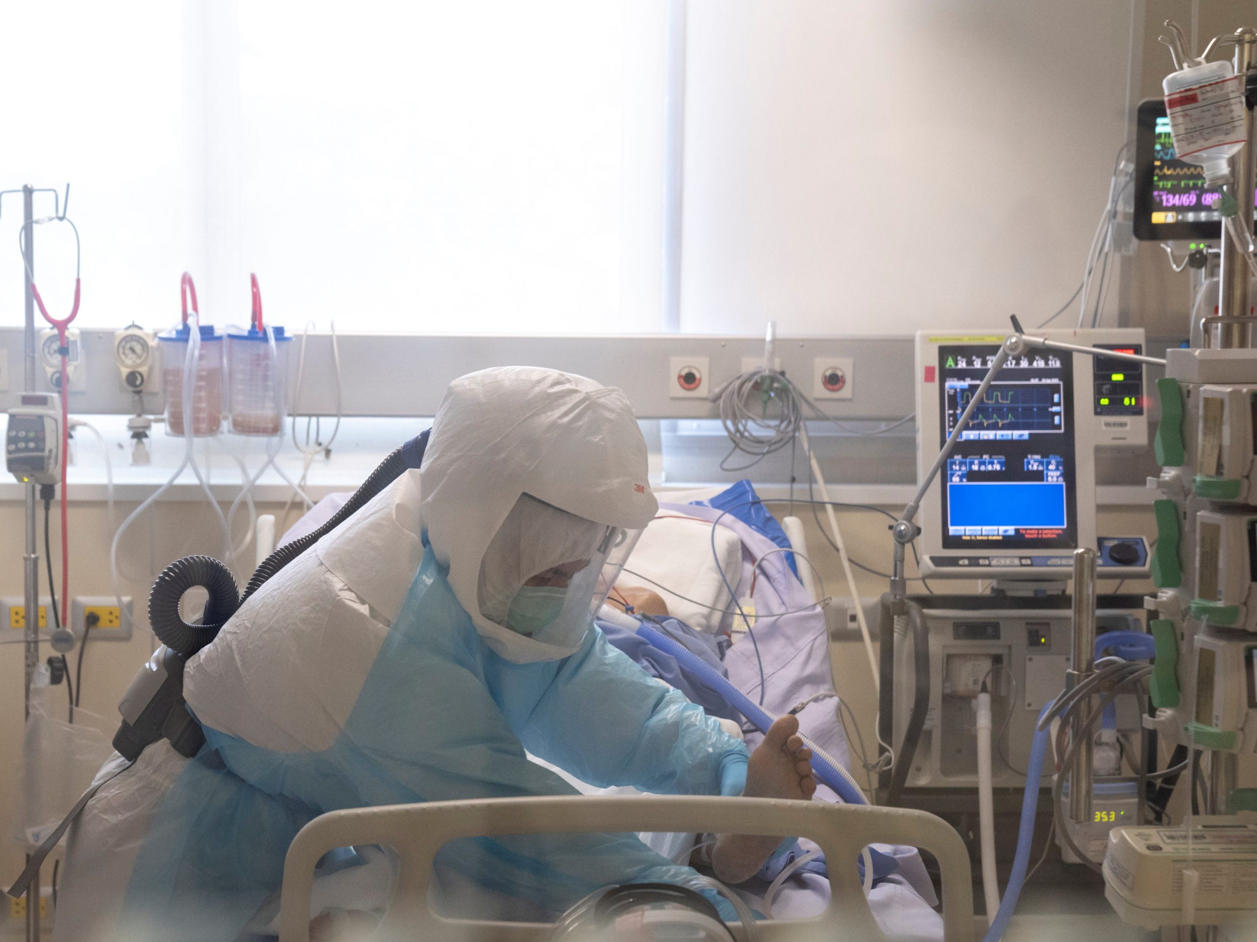 FILE PHOTO: An ICU nurse wearing personal protection equipment (PPE) takes care of a COVID-19 patient in the intensive care unit at the King Chulalongkorn Memorial Hospital in Bangkok, Thailand, April 23, 2020.  REUTERS/Athit Perawongmetha