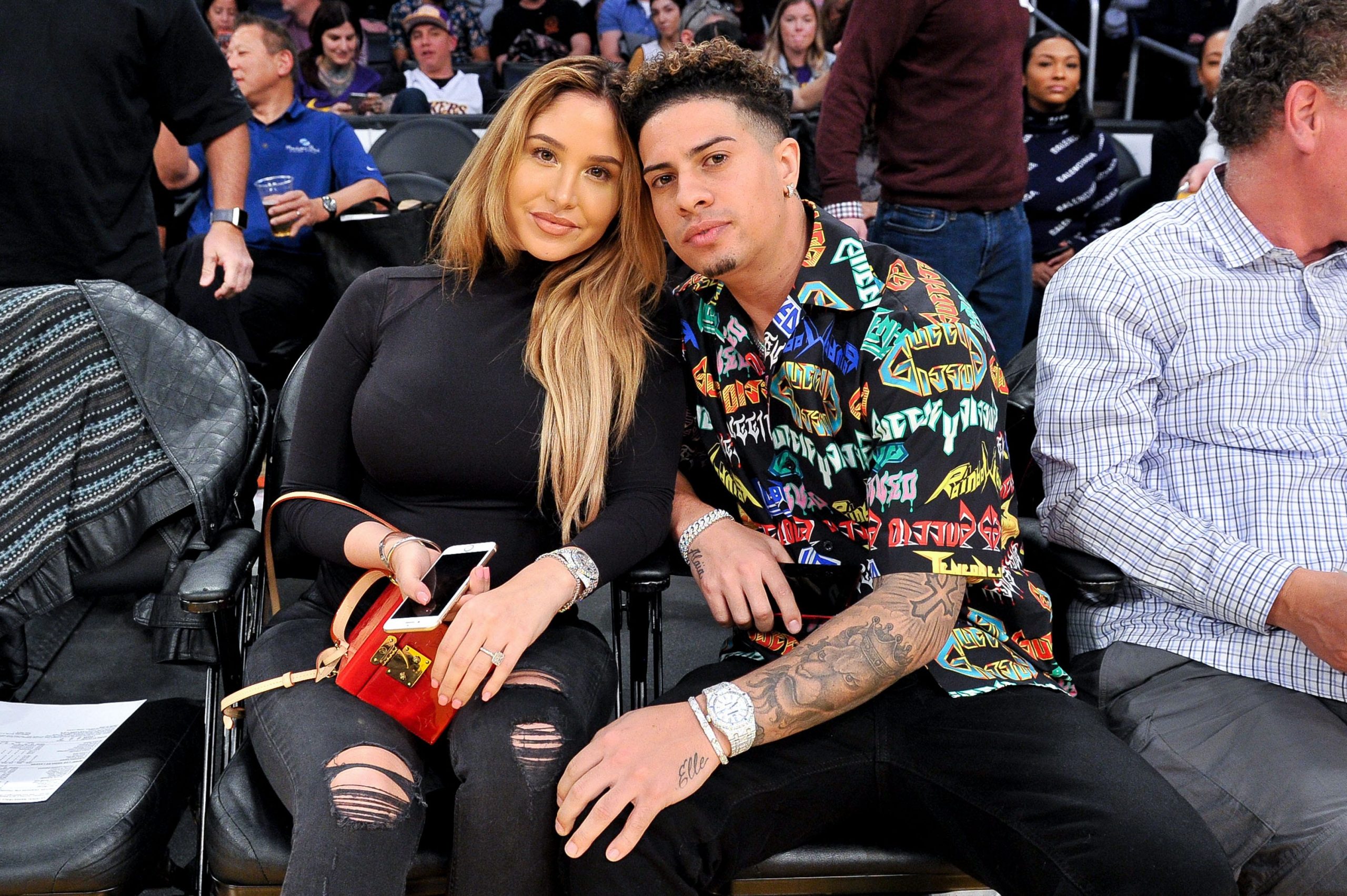 Austin McBroom and Catherine Paiz attend a basketball game between the Los Angeles Lakers and the Oklahoma City Thunder at Staples Center on January 02, 2019 in Los Angeles, California.