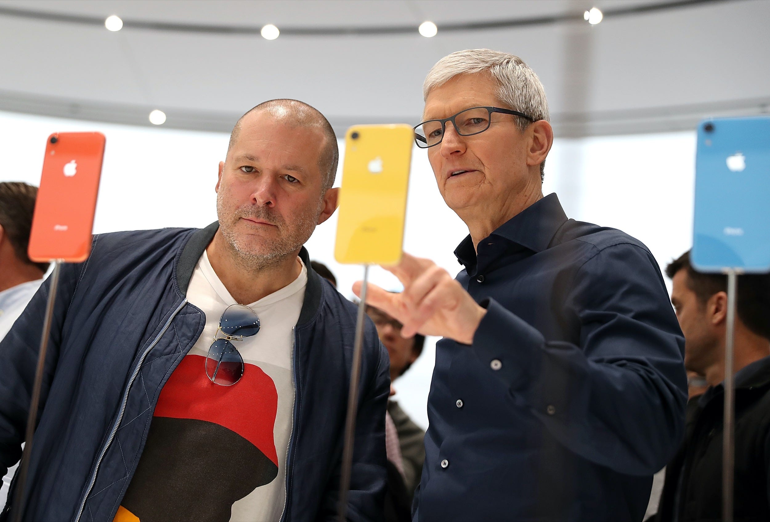jony ive apple CUPERTINO, CA - SEPTEMBER 12: Apple chief design officer Jony Ive (L) and Apple CEO Tim Cook inspect the new iPhone XR during an Apple special event at the Steve Jobs Theatre on September 12, 2018 in Cupertino, California. Apple released three new versions of the iPhone and an update Apple Watch. (Photo by Justin Sullivan/Getty Images)