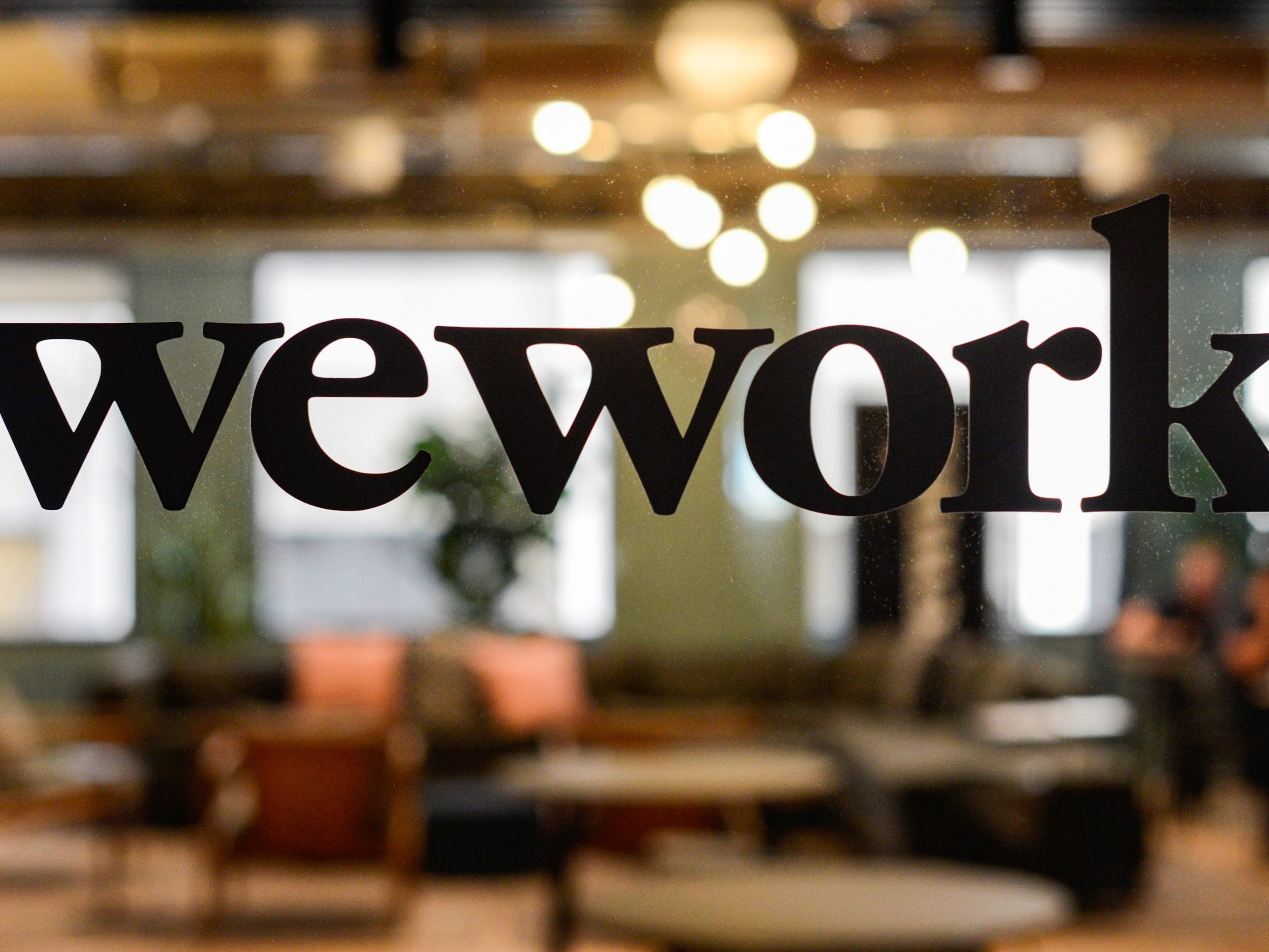 FILE PHOTO: A WeWork logo is seen at a WeWork office in San Francisco, California, U.S. September 30, 2019.  REUTERS/Kate Munsch
