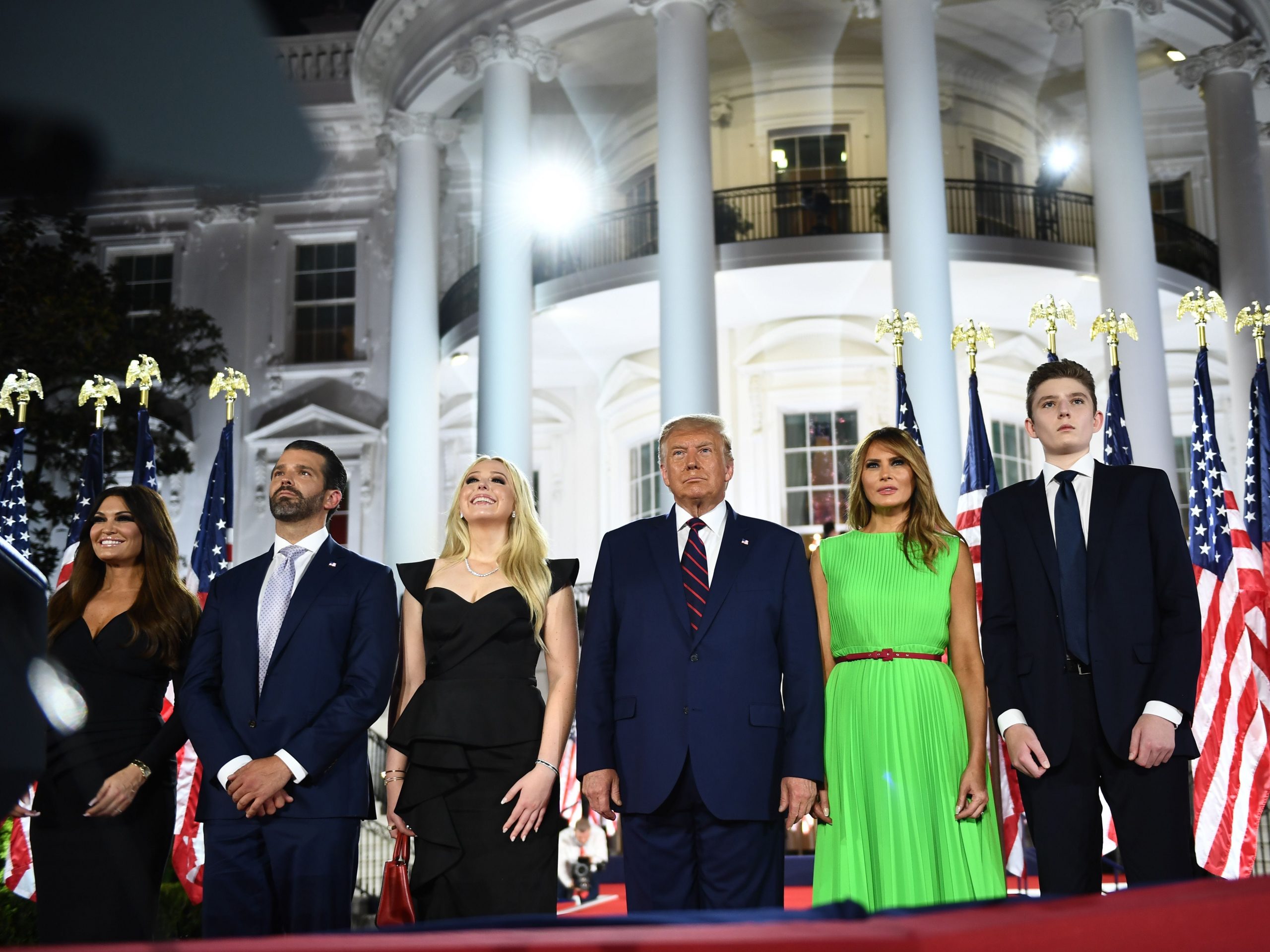 Barron Trump, US First Lady Melania Trump, US President Donald Trump, Tiffany Trump, Donald Trump Jr. and Kimberly Guilfoyle watch fireworks at the conclusion of the final day of the Republican National Convention from the South Lawn of the White House on August 27, 2020 in Washington, DC.