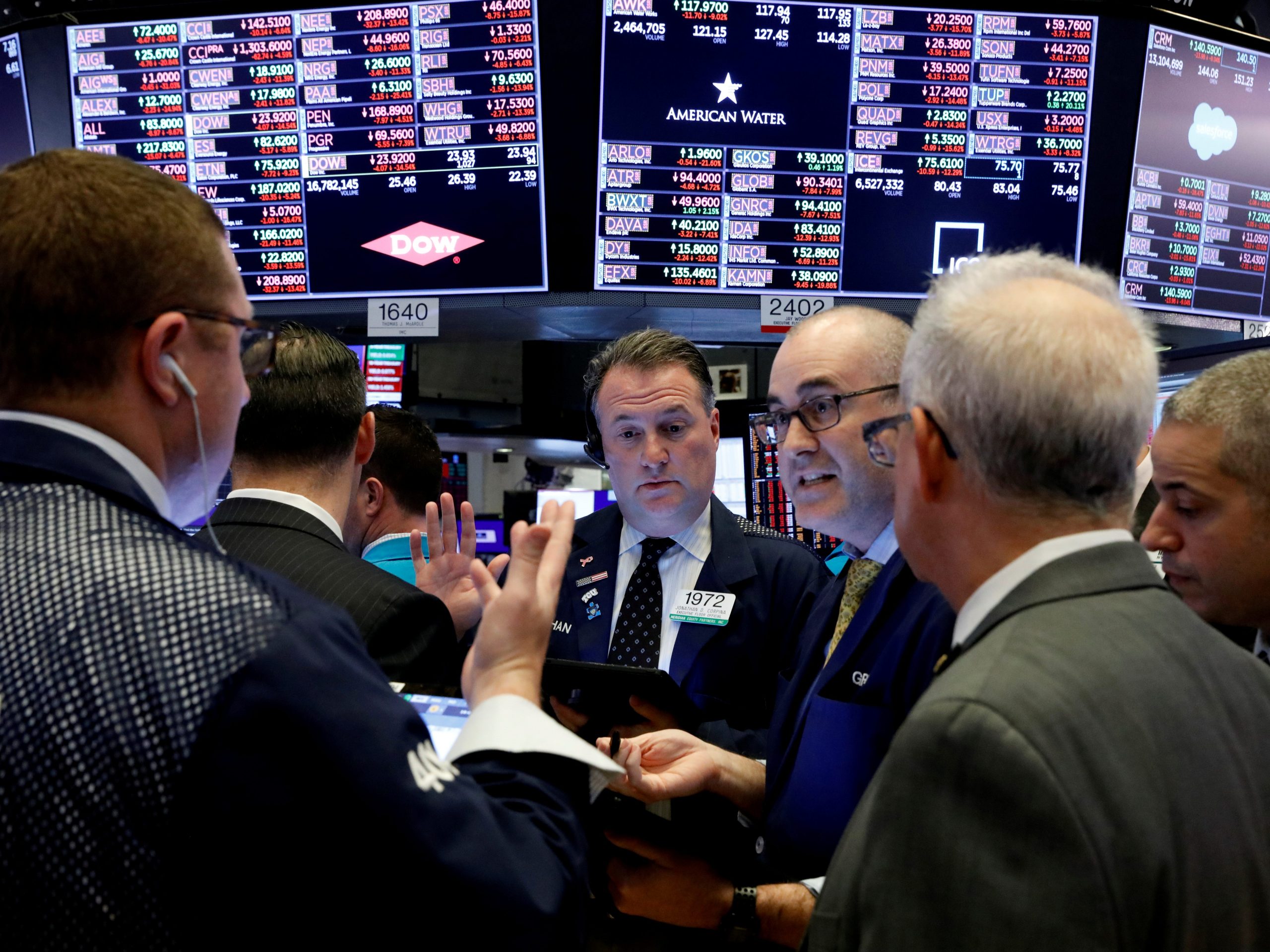 FILE PHOTO: Traders work on the floor of the New York Stock Exchange (NYSE) near the close of trading in New York, U.S., March 12, 2020. REUTERS/Brendan McDermid/File Photo