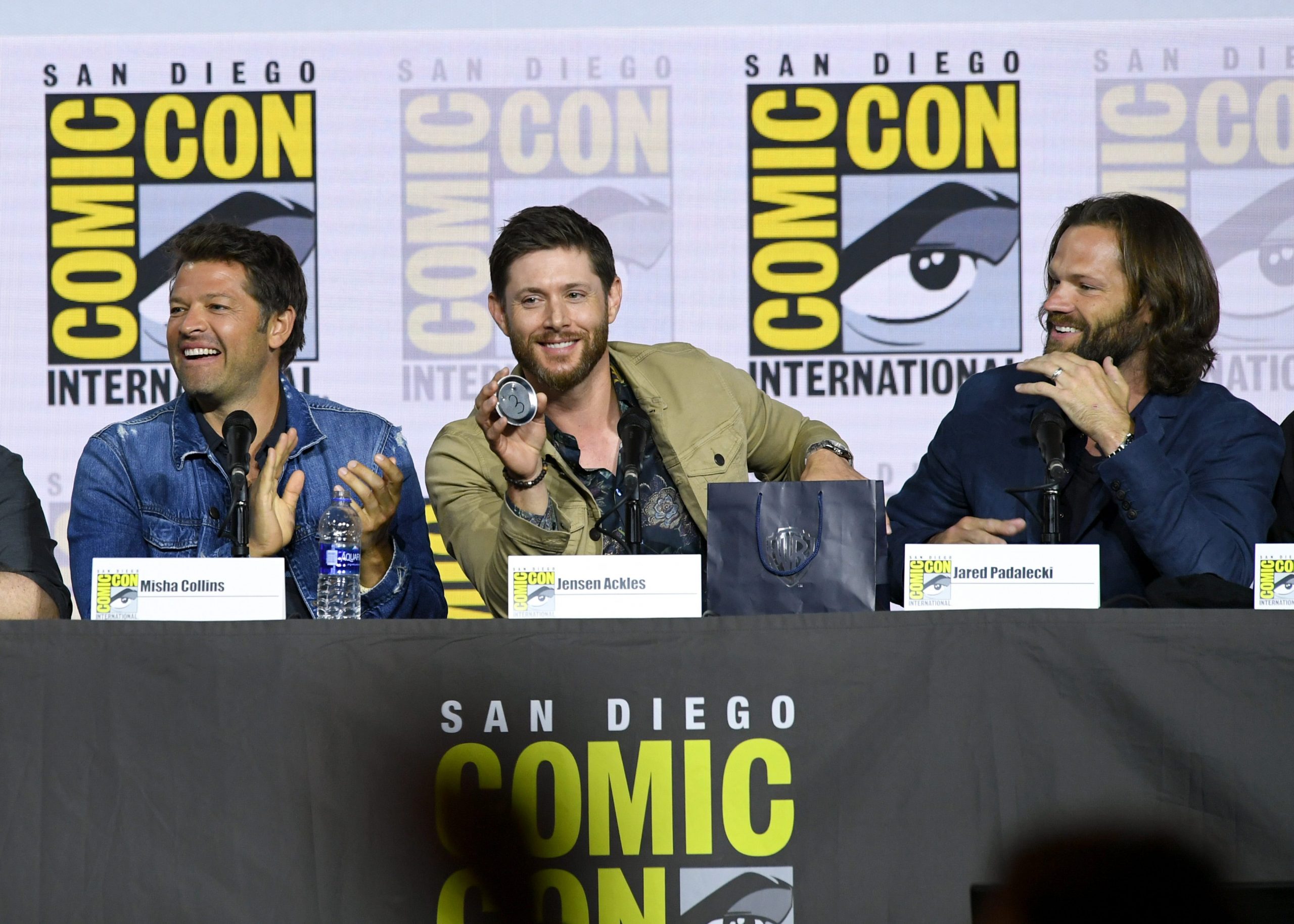 Misha Collins, Jensen Ackles, and Jared Padalecki speak at the "Supernatural" Special Video Presentation and Q&A during 2019 Comic-Con International at San Diego Convention Center on July 21, 2019 in San Diego, California.