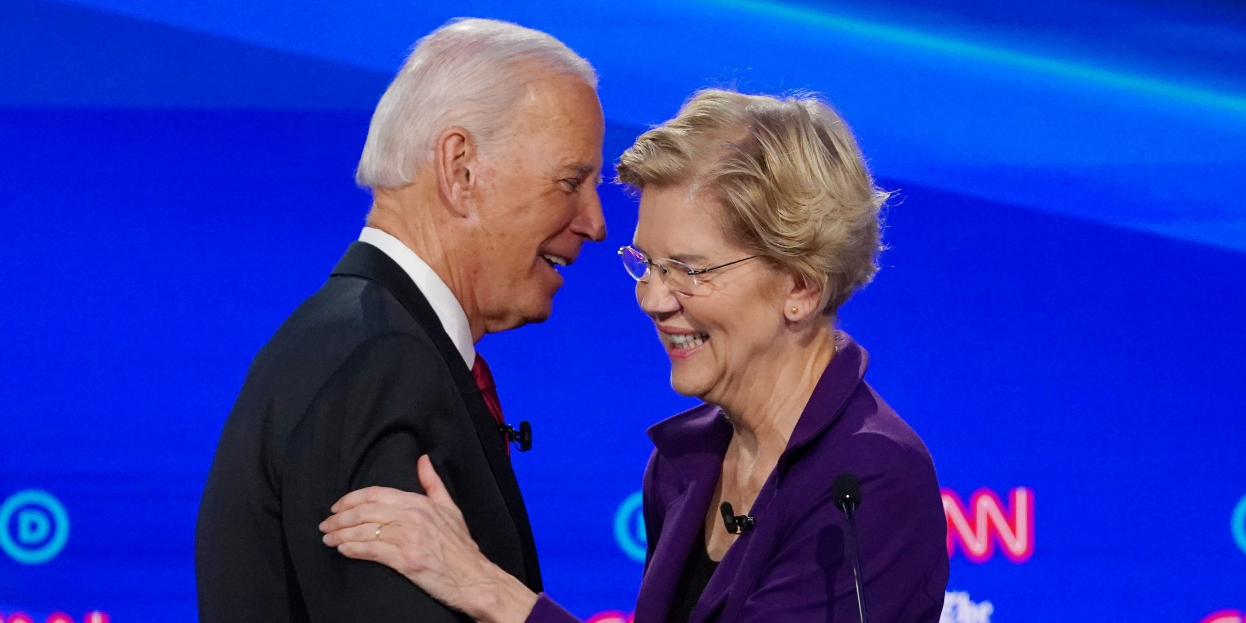 FILE PHOTO: Democratic presidential candidate and former Vice President Joe Biden shakes hands with and hugs Senator Elizabeth Warren after a question about their ages during the fourth U.S. Democratic presidential candidates 2020 election debate at Otterbein University in Westerville, Ohio U.S., October 15, 2019. REUTERS/Shannon Stapleton