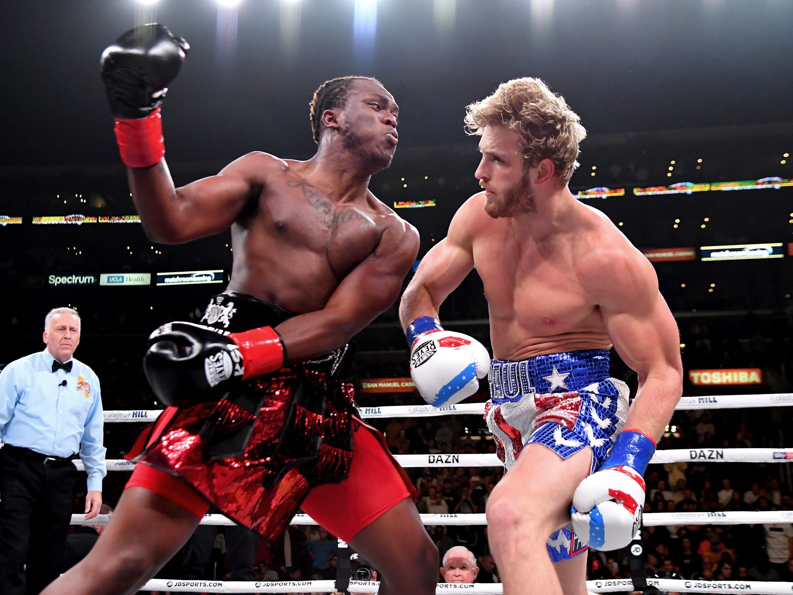 Logan Paul (red/white/blue shorts) and KSI (black/red shorts) exchange punches their pro debut cruiserweight fight at Staples Center on November 9, 2019 in Los Angeles, California. KSI won by decision.