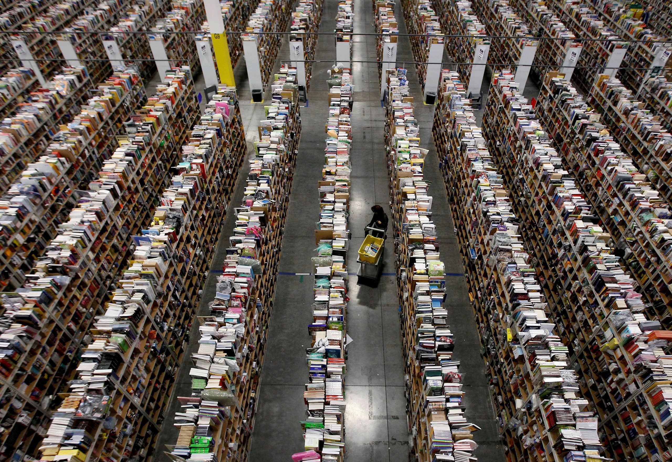 Amazon warehouse in Phoenix with rows of books.JPG