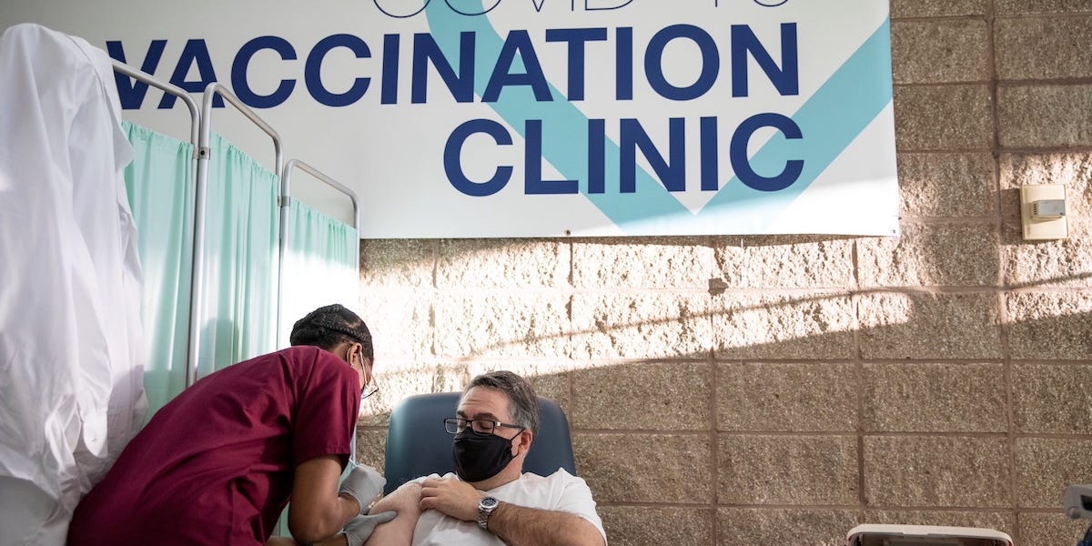 Nurse practitioner Tabe Mase gives U.S. President-elect Joe Biden a dose of a vaccine against the coronavirus disease (COVID-19) at ChristianaCare Christiana Hospital, in Newark, Delaware, U.S. December 21, 2020. REUTERS/Leah Millis