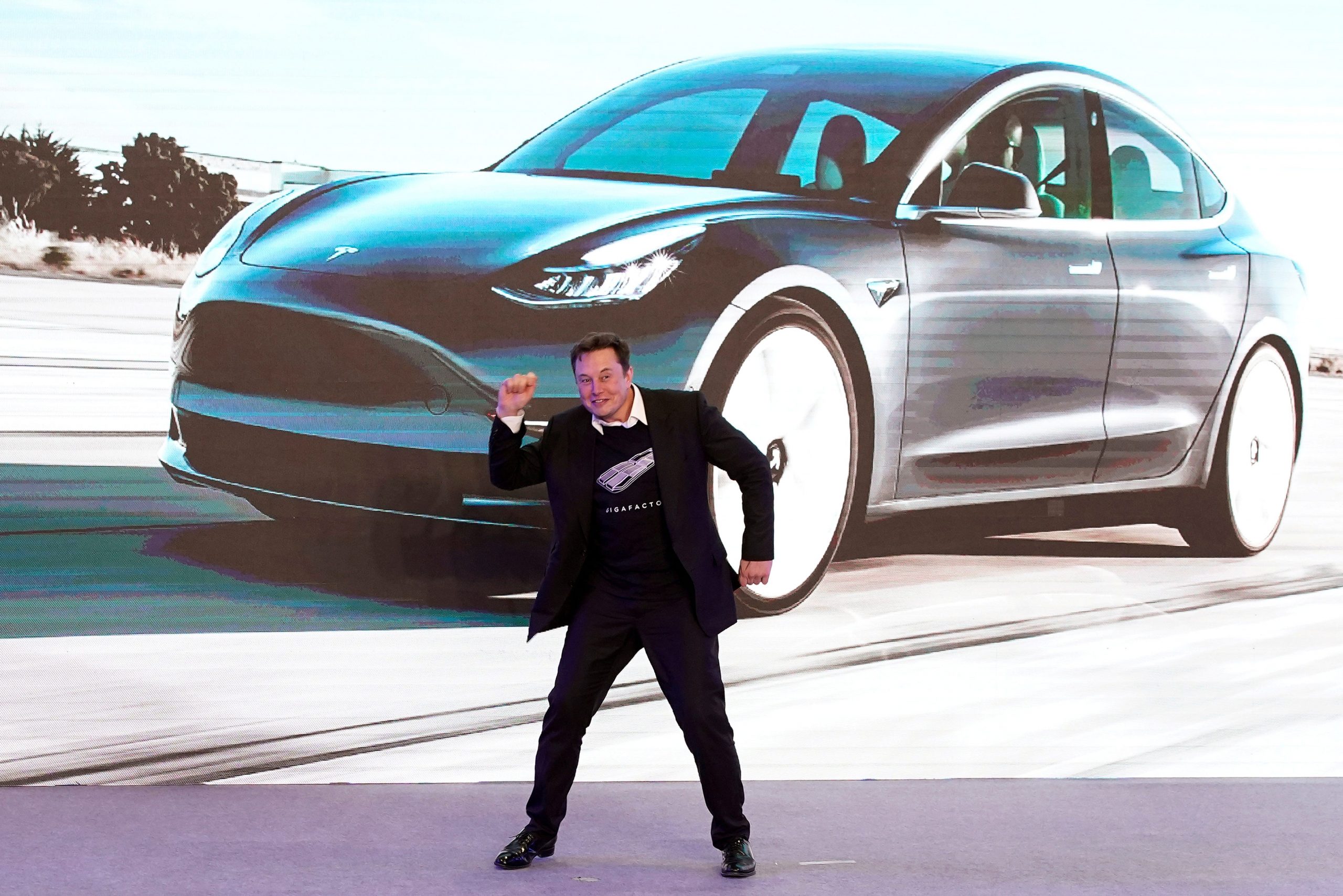 FILE PHOTO: Tesla Inc CEO Elon Musk dances onstage during a delivery event for Tesla China-made Model 3 cars in Shanghai, China January 7, 2020. REUTERS/Aly Song/File Photo