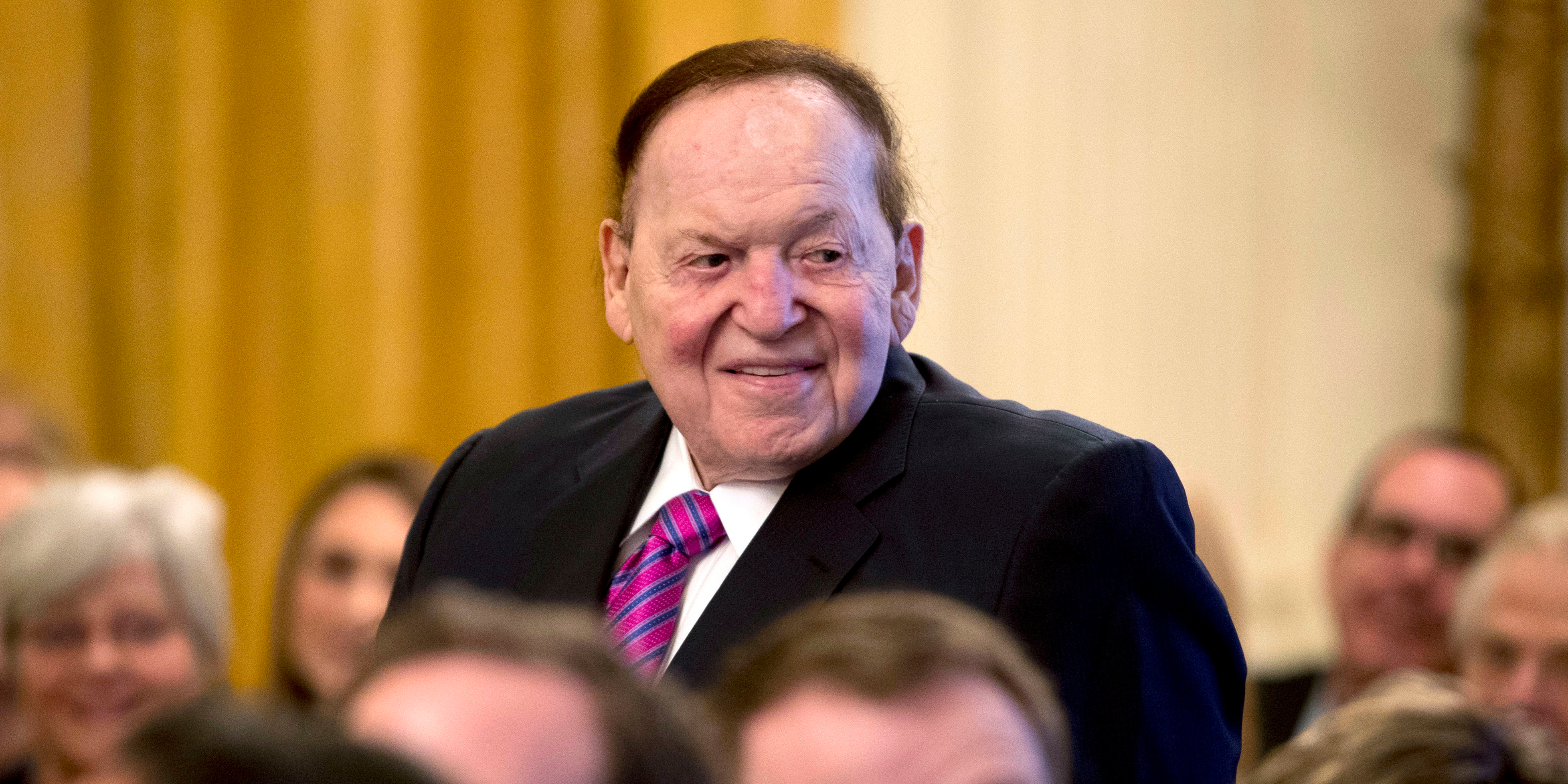 FILE - In this Nov. 16, 2018, file photo, Las Vegas Sands Corporation Chief Executive and Republican mega donor Sheldon Adelson, stands as he is recognized by President Donald Trump during a Medal of Freedom ceremony in the East Room of the White House in Washington. Casino magnate and GOP donor Adelson is not in good health and has not being at his company's offices in Las Vegas since around Christmas Day. Las Vegas Sands Corp. on Thursday, Feb. 28, 2019, did not immediately respond to a request for comment. Attorney James Jimmerson told the court the condition of the 85-year-old billionaire is dire. (AP Photo/Andrew Harnik, File)