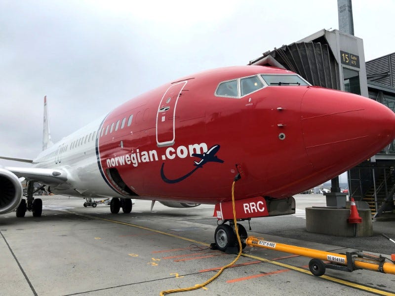 FILE PHOTO: A Norwegian Air plane is refuelled at Oslo Gardermoen airport, Norway, November 7, 2019. REUTERS/Lefteris Karagiannopoulos/File Photo