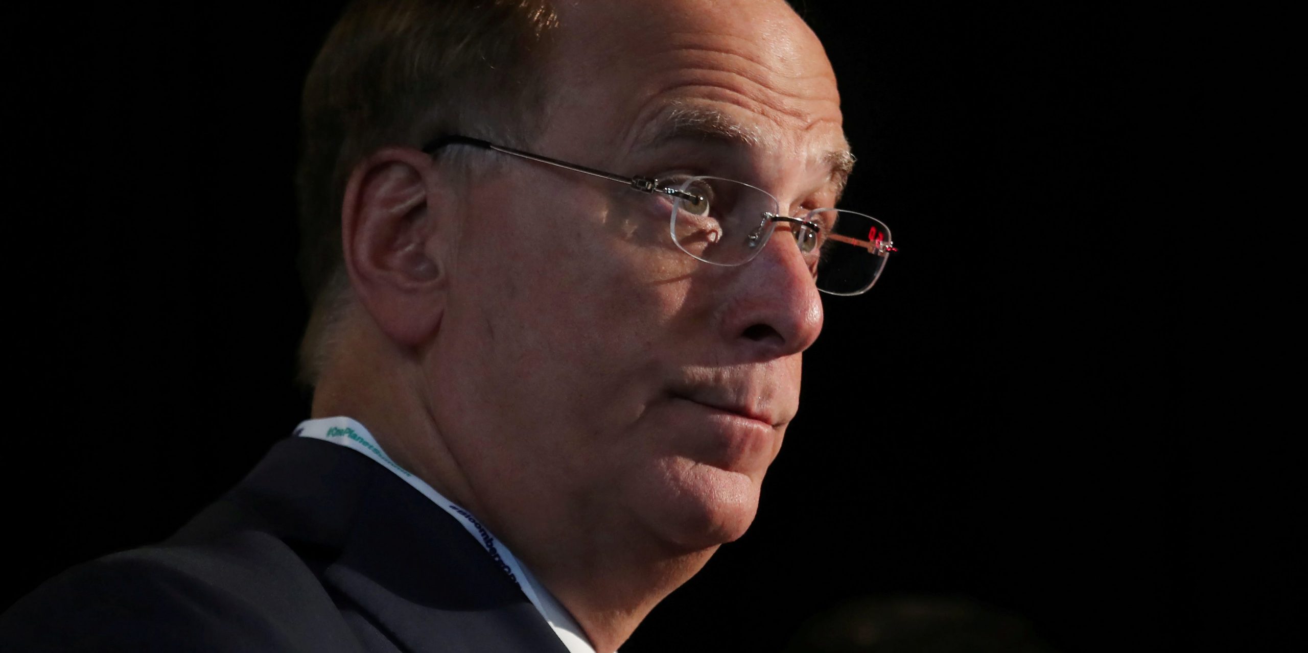 FILE PHOTO: Larry Fink, Chief Executive Officer of BlackRock, stands at the Bloomberg Global Business forum in New York, U.S., September 26, 2018. REUTERS/Shannon Stapleton